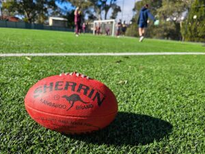 AFL football sitting on grass